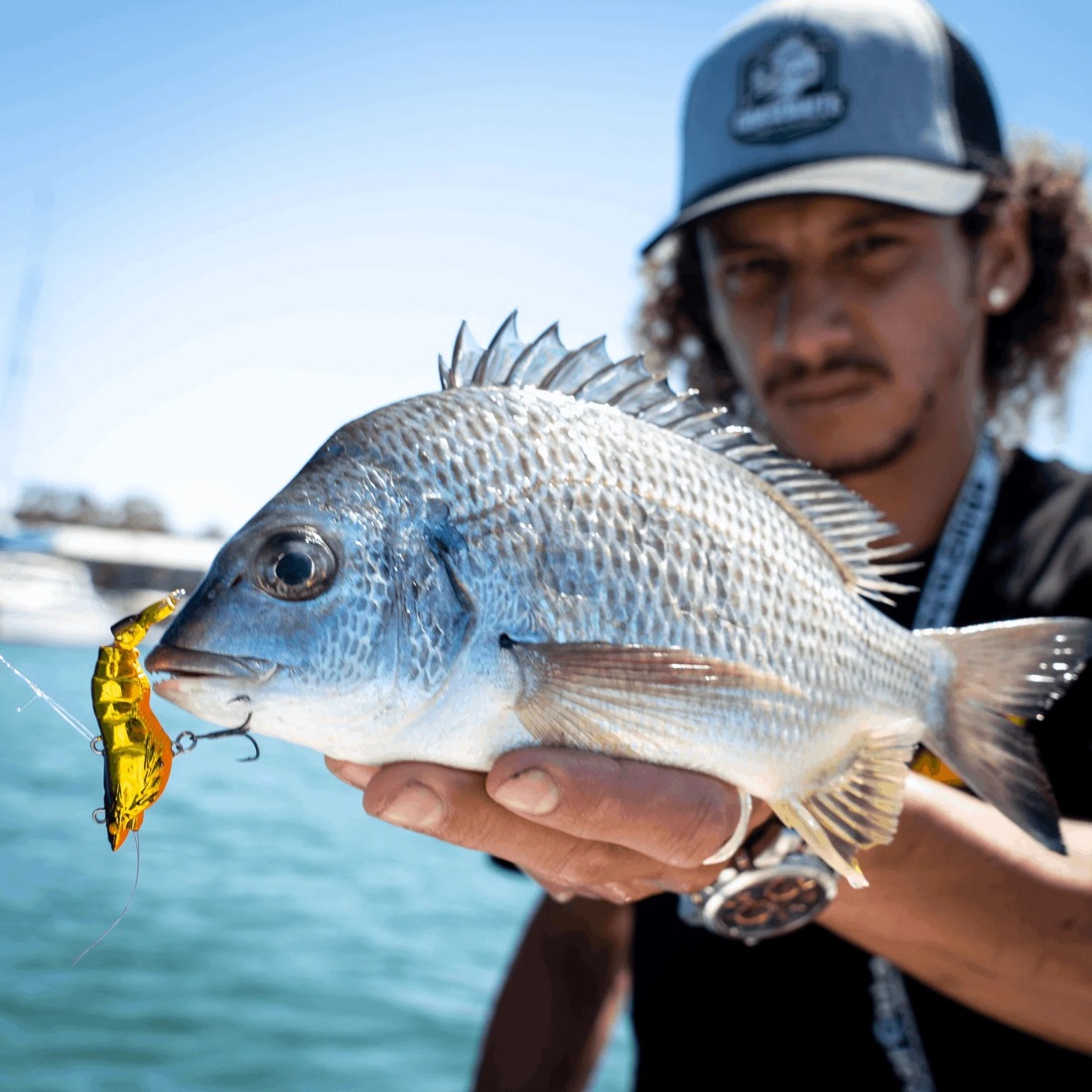 Angler holding a bream