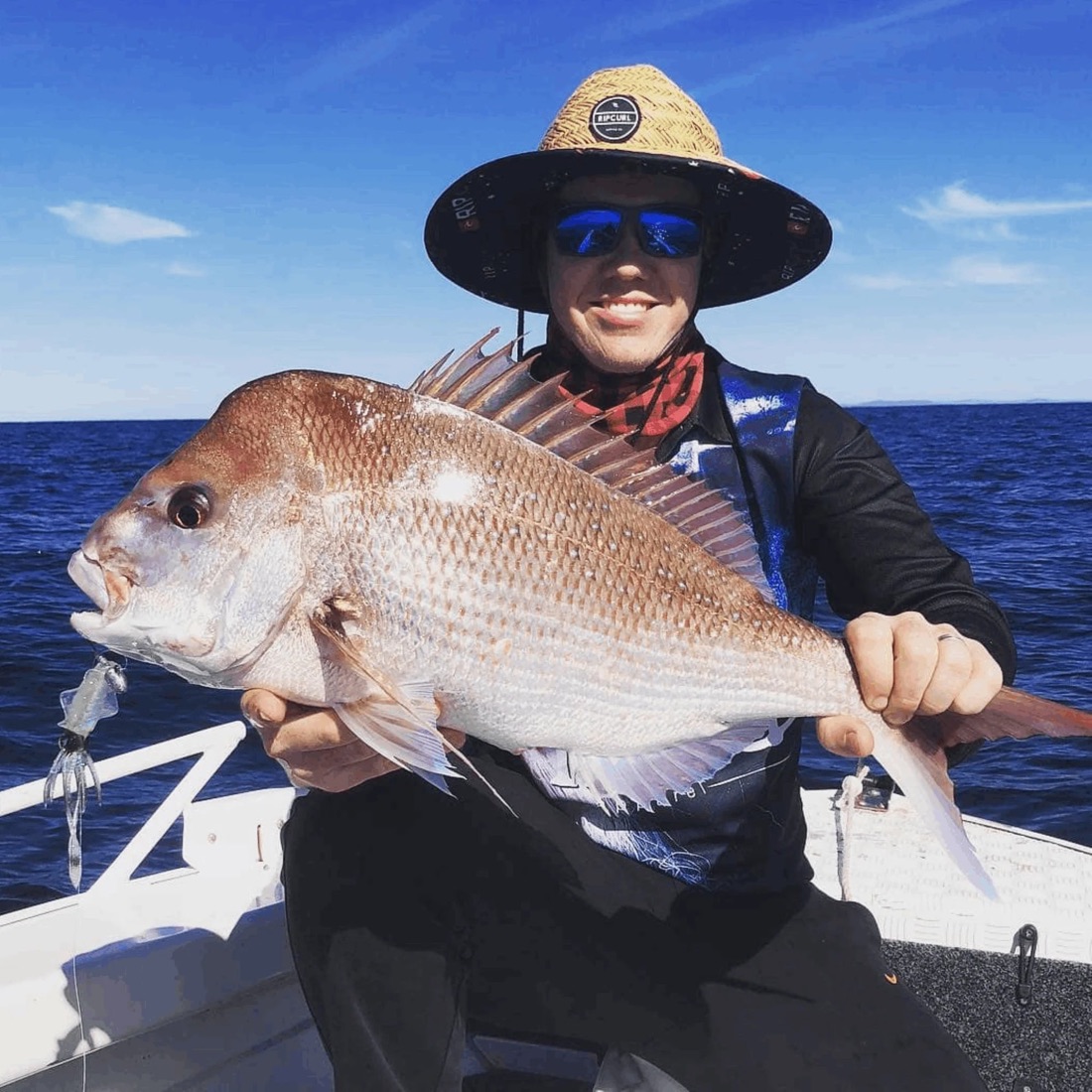 Angler holding a snapper