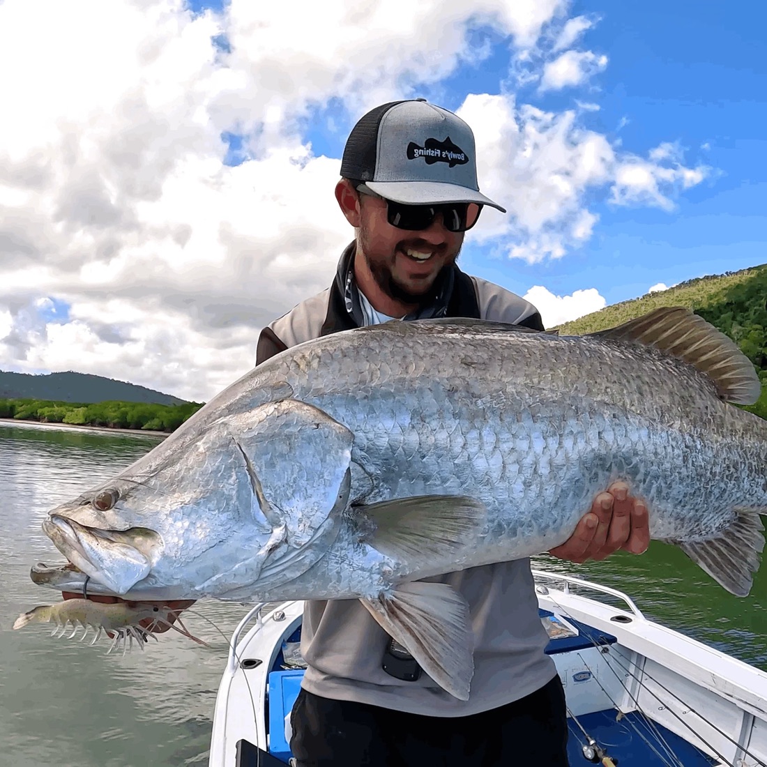 Angler holding a barramundi
